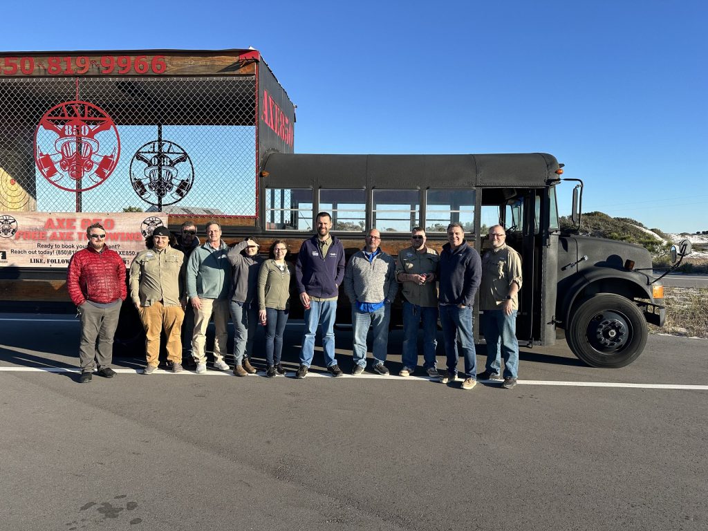 The Resorts Locksmith Services team standing in front of a bus vehicle